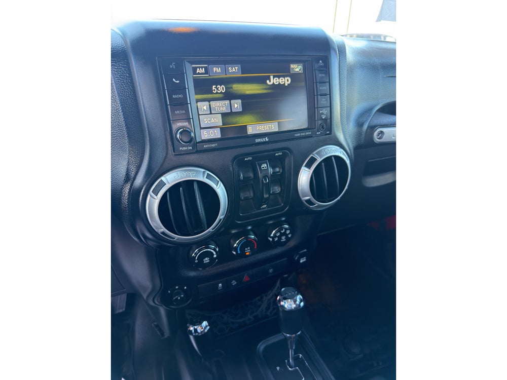 2014 Jeep Wrangler Unlimited Sahara — manufacturer image; actual vehicle may differ