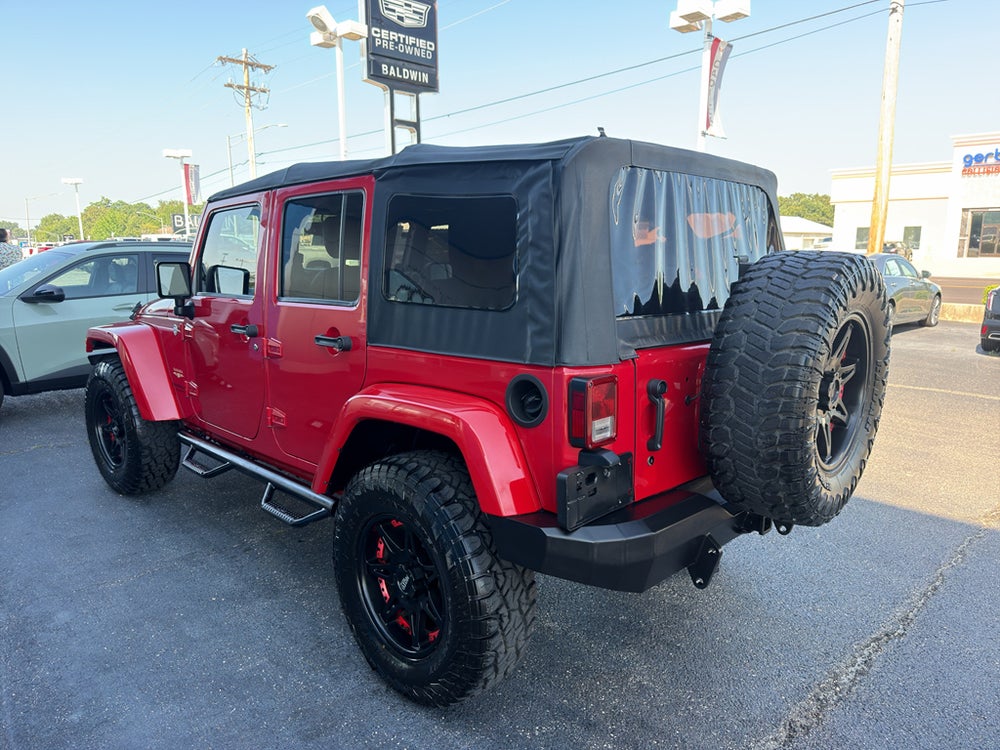 2014 Jeep Wrangler Unlimited Sahara — manufacturer image; actual vehicle may differ